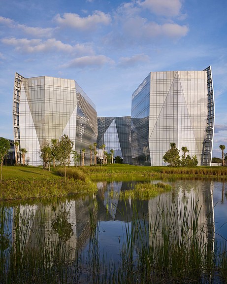A body of water with buildings in the background.